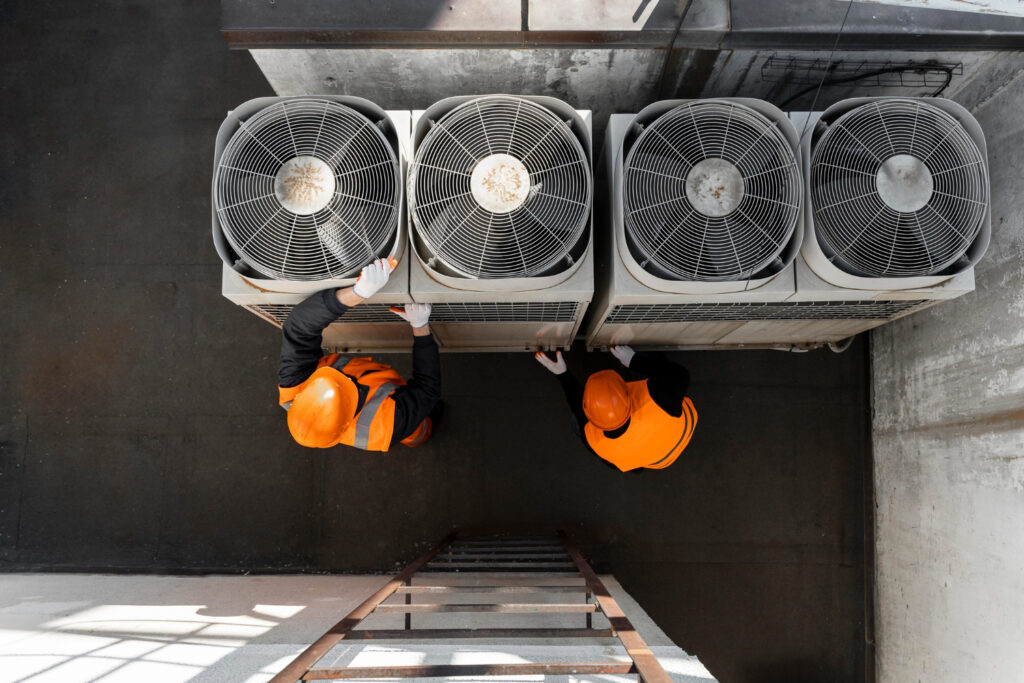 HVAC technician comparing R-410A and R-32 refrigerants for future-compatible AC system