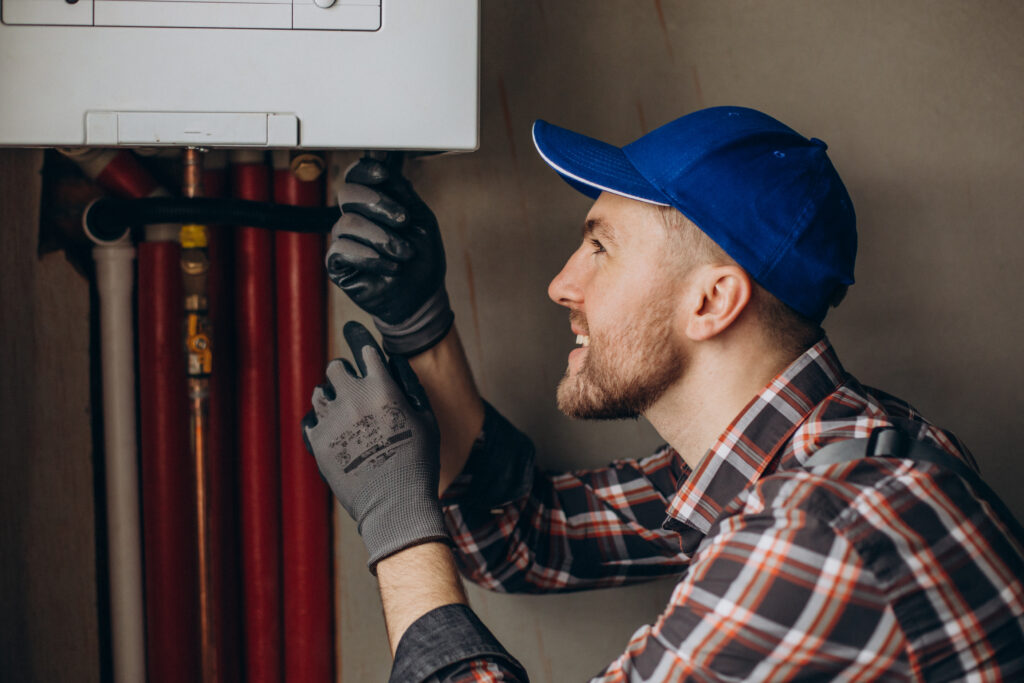 Technician performing seasonal HVAC maintenance