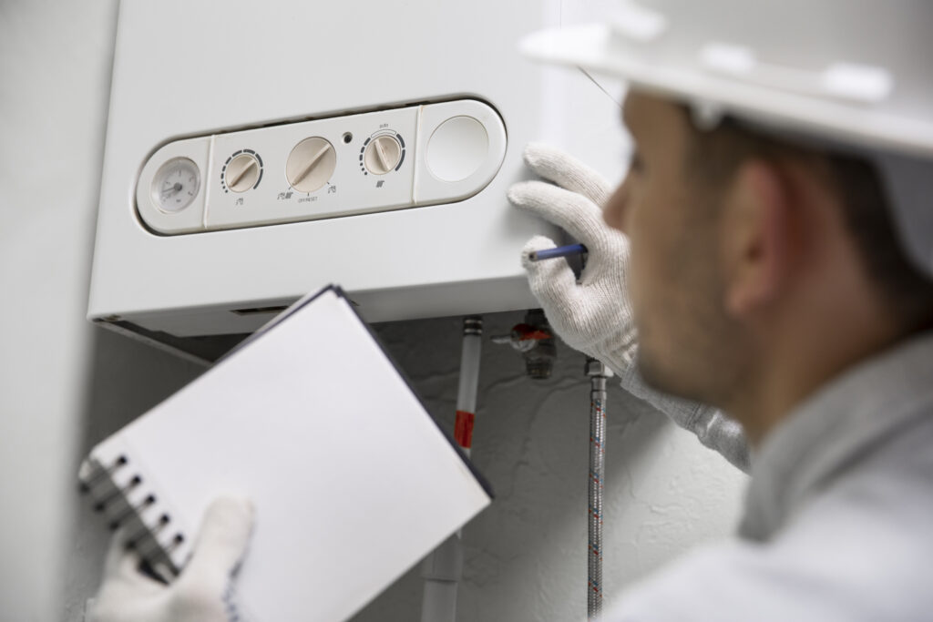 Worker Repairing Boiler